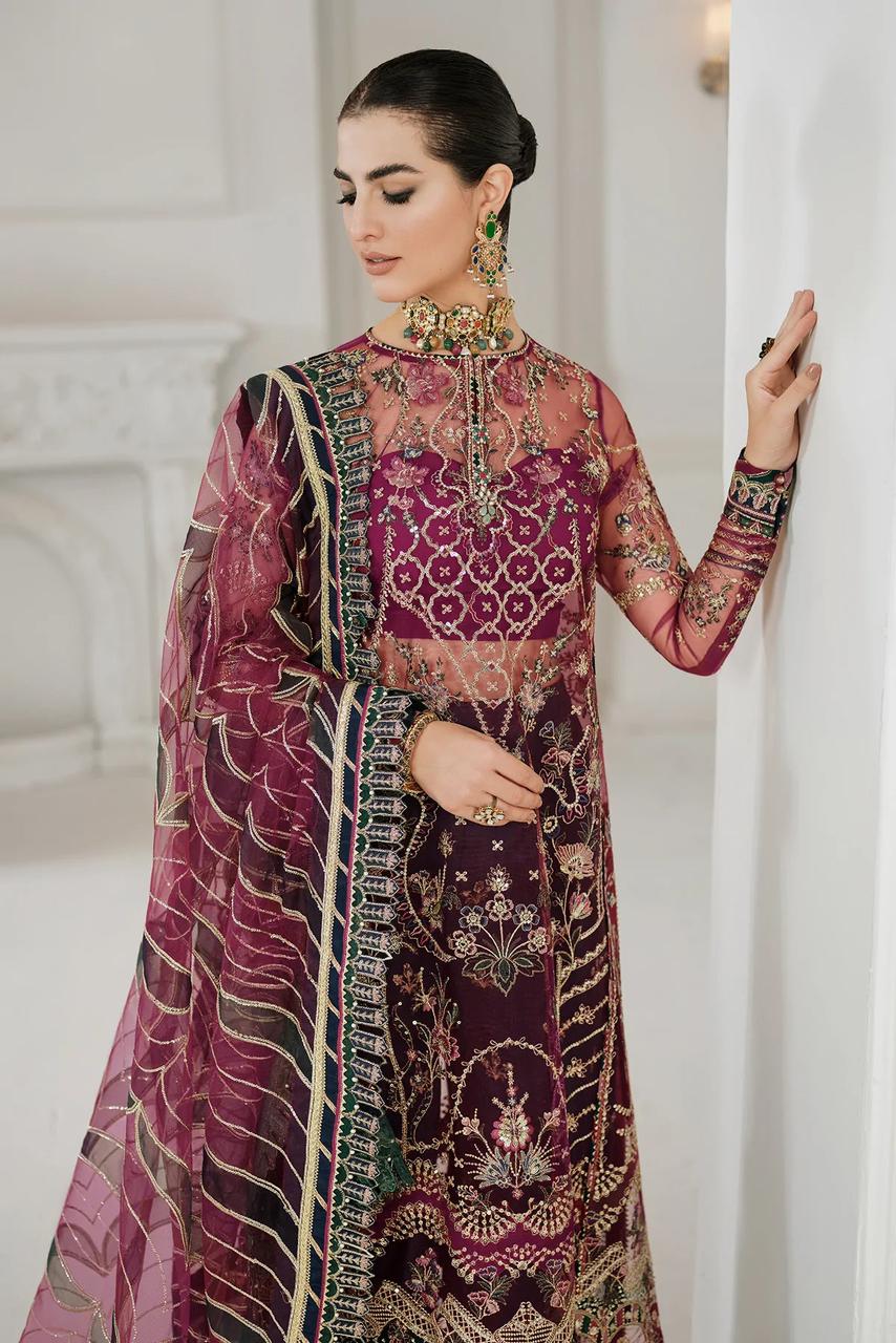 Baroque Wedding Dress wearing a traditional embroidered outfit with a pink and purple color scheme.
