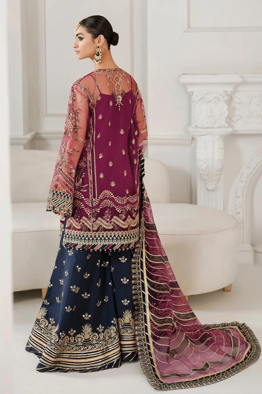BAroque red dress wearing a traditional embroidered outfit in a white room.