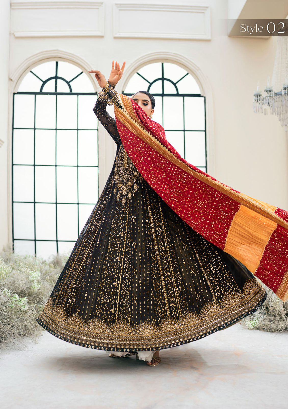 Aik Atelier Wz 02 Black Beauty Chiffon Maxi Frock For Wedding Bridal  black and gold traditional outfit with a red and gold dupatta, standing indoors.
