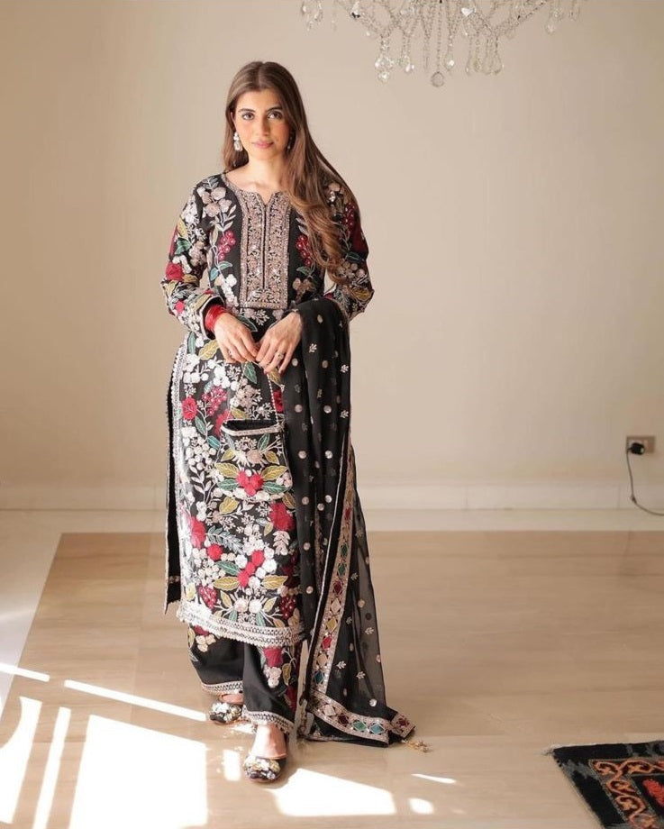 Haseen Mehnaaz Floral wearing a traditional outfit with floral patterns in a well-lit room.