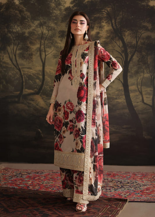 Woman in a floral dress with a matching dupatta standing against a painted landscape background.