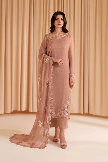 Iznik Wz 09 Semi Pure Chiffon Dress 2025 wearing a pink traditional outfit with embroidery against a beige curtain background