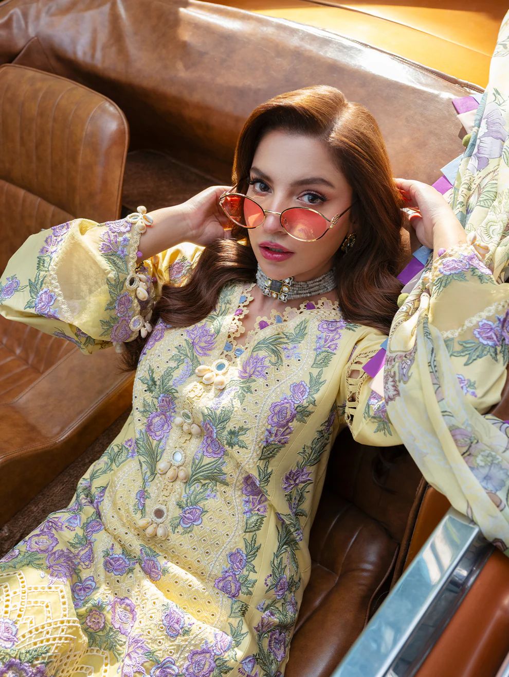 Jade Ombre Purple Dananeer Lemon in a floral dress sitting in a vintage car