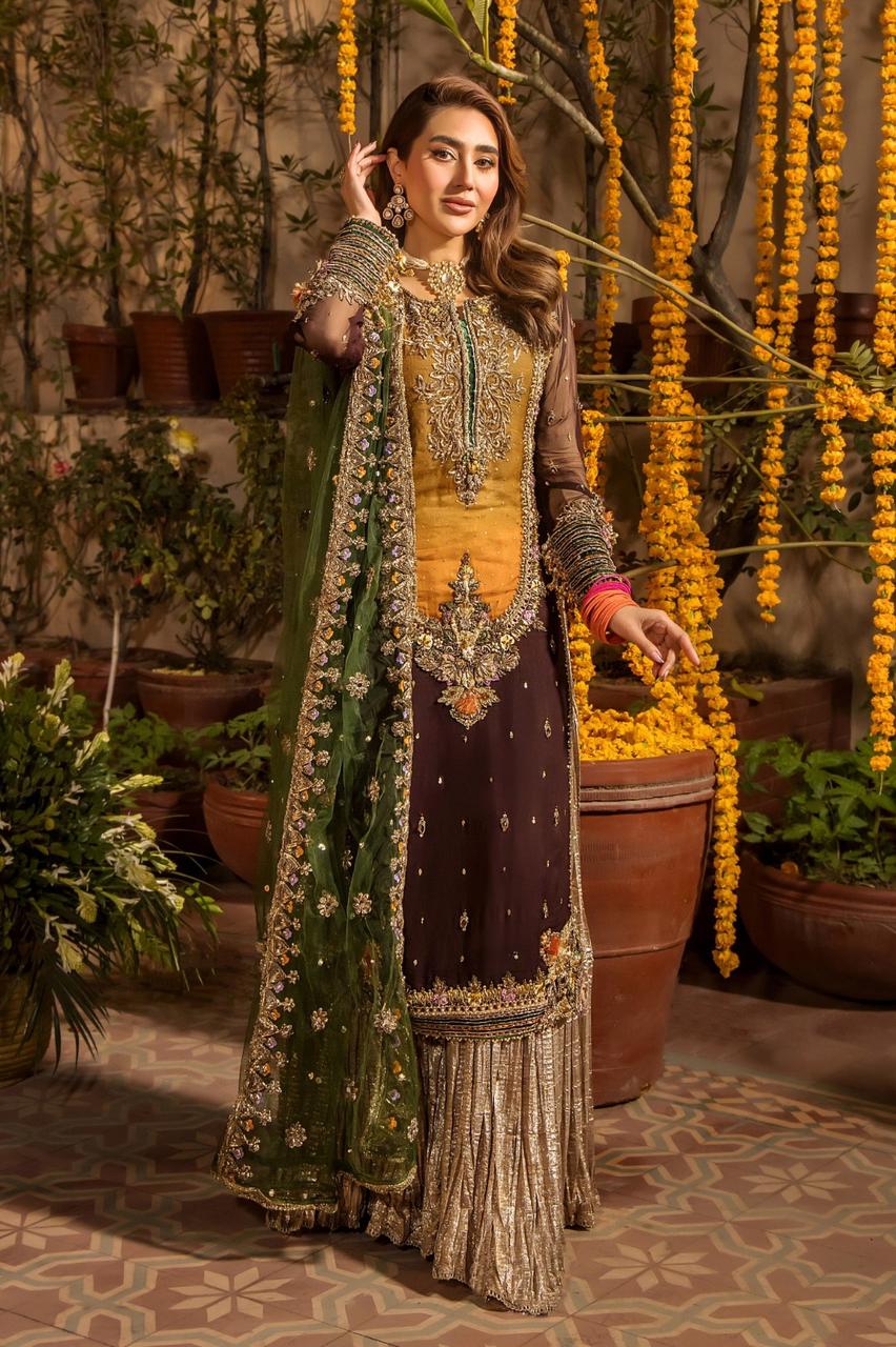 Woman in traditional outfit with floral decorations in a decorated indoor setting
