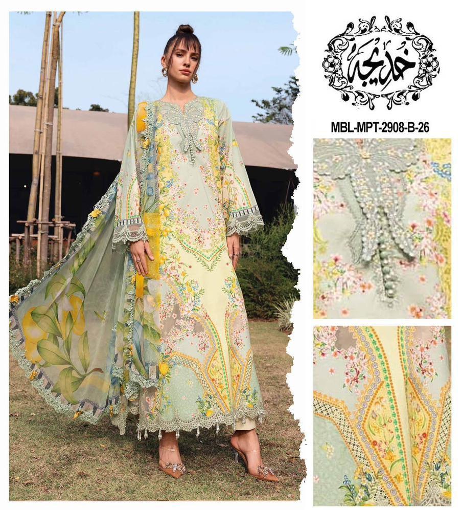 Woman wearing a floral embroidered dress with a brand logo on the top right corner.