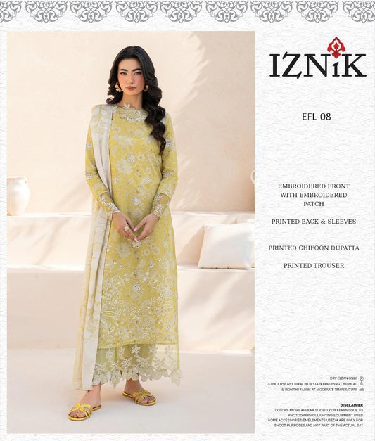 Woman wearing a yellow embroidered outfit with Iznik branding on a beige background