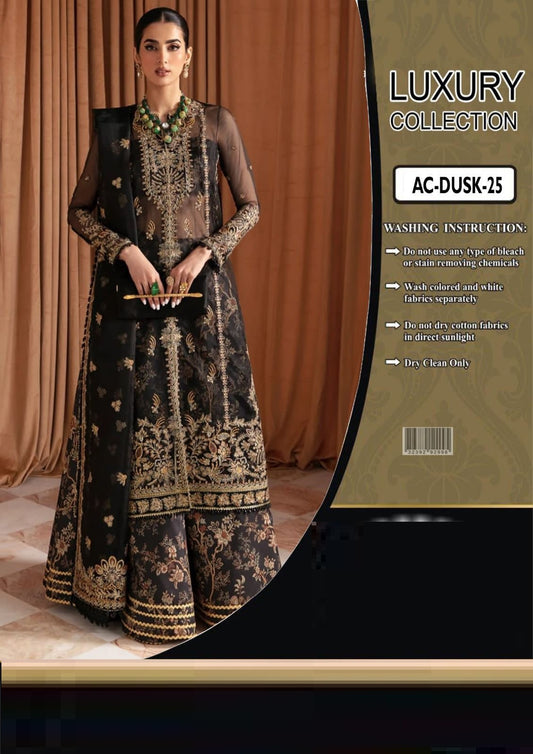 Woman in a black and gold traditional Ayzel By Afrozeh outfit with a 'Luxury Collection' label in the background.