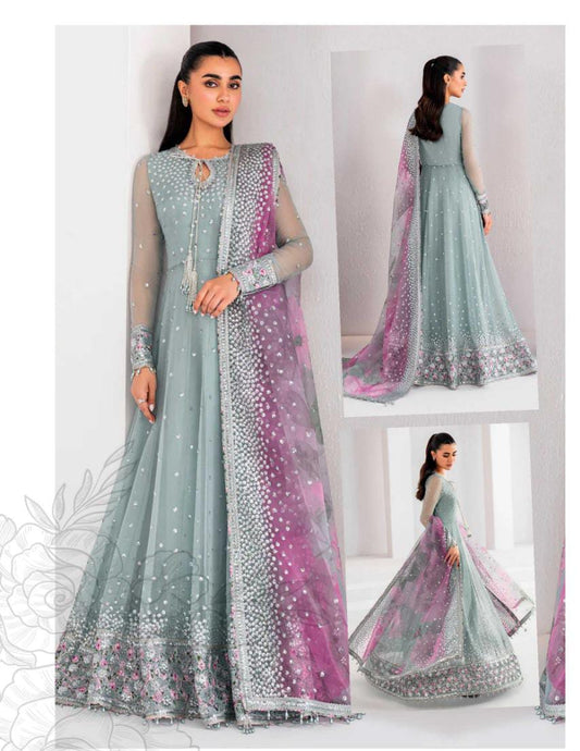 Woman wearing a light blue and pink traditional outfit with a matching dupatta.