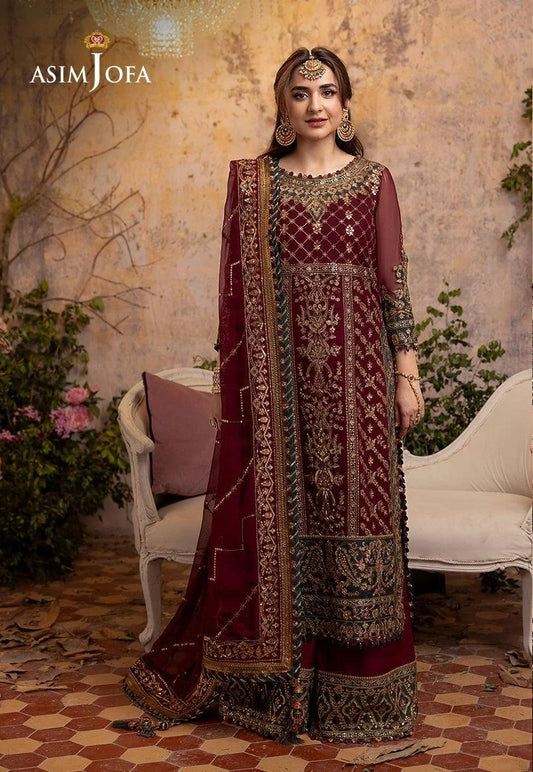 Woman in a maroon and gold embroidered traditional outfit with 'Asim Jofa' branding.