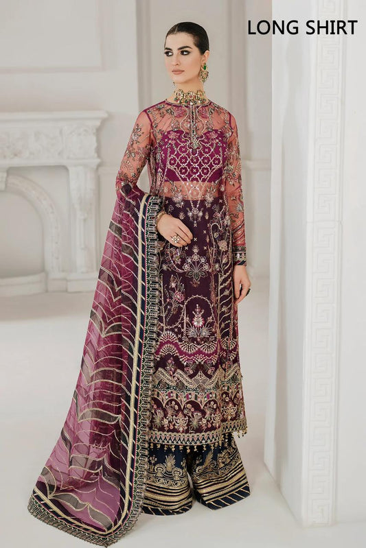 Baroque Garara Red wearing a traditional embroidered outfit with a long shirt in a white room.