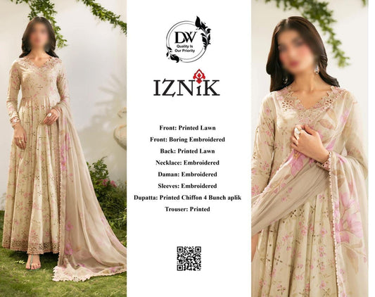 Beige embroidered traditional outfit with floral patterns, displayed on a model against a natural background.
