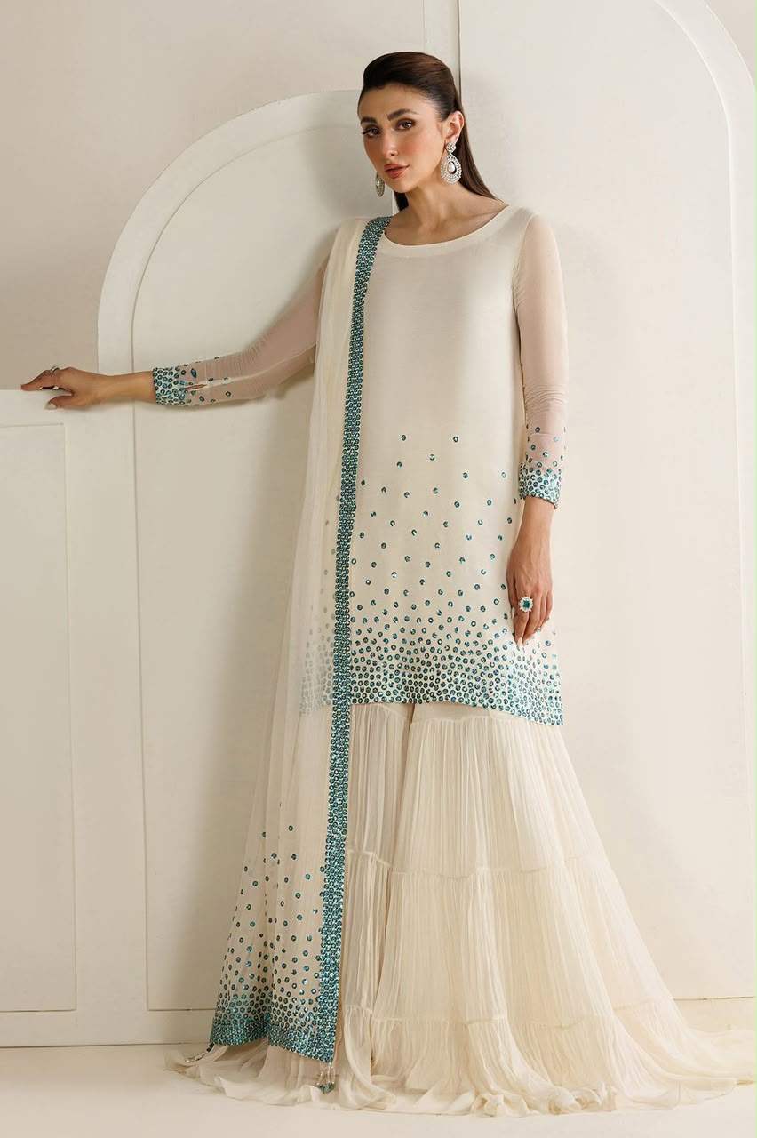 Woman wearing a traditional outfit with a white background